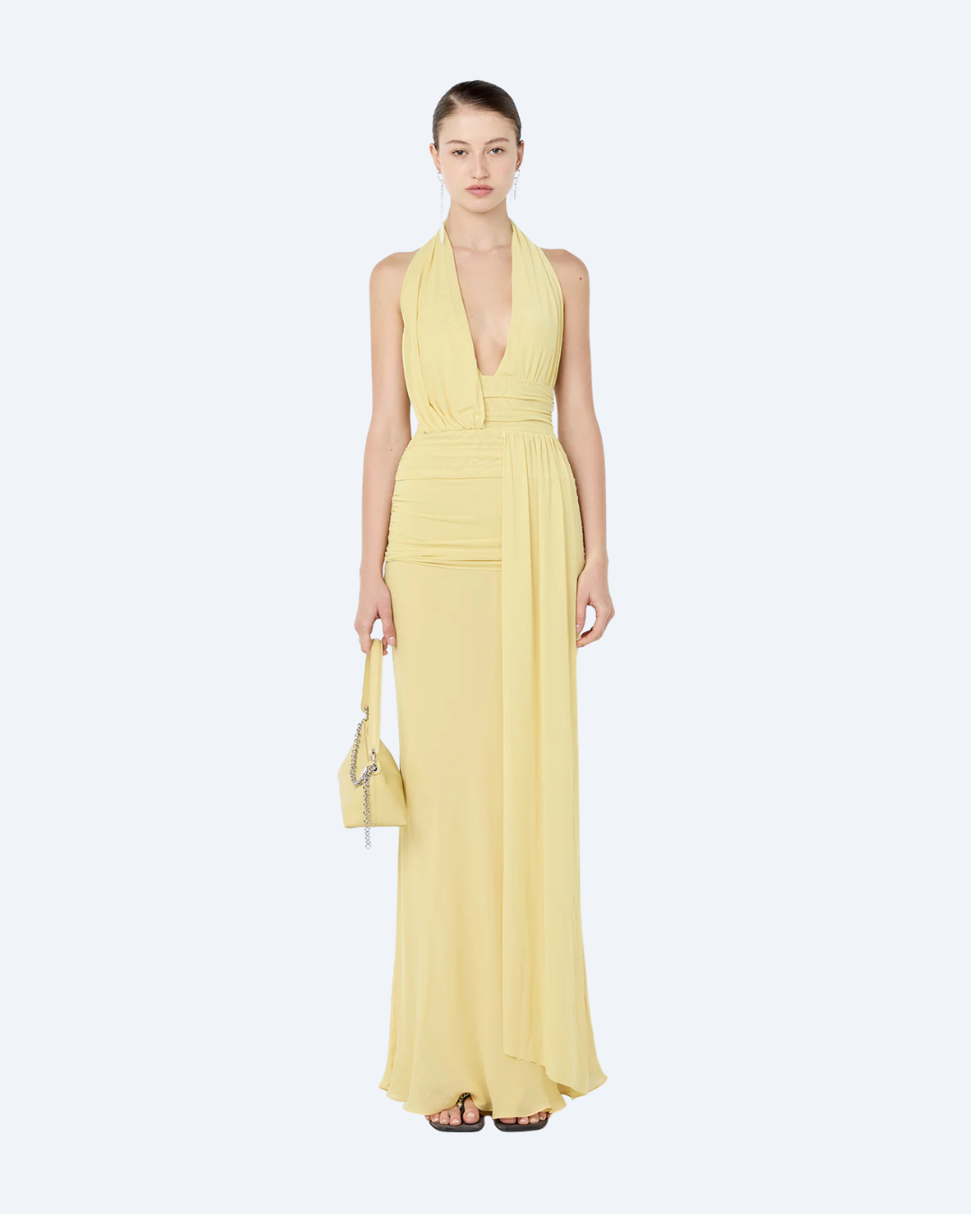Woman wearing a yellow Bec and Bridge Cassis drape maxi dress, front view, on a white background