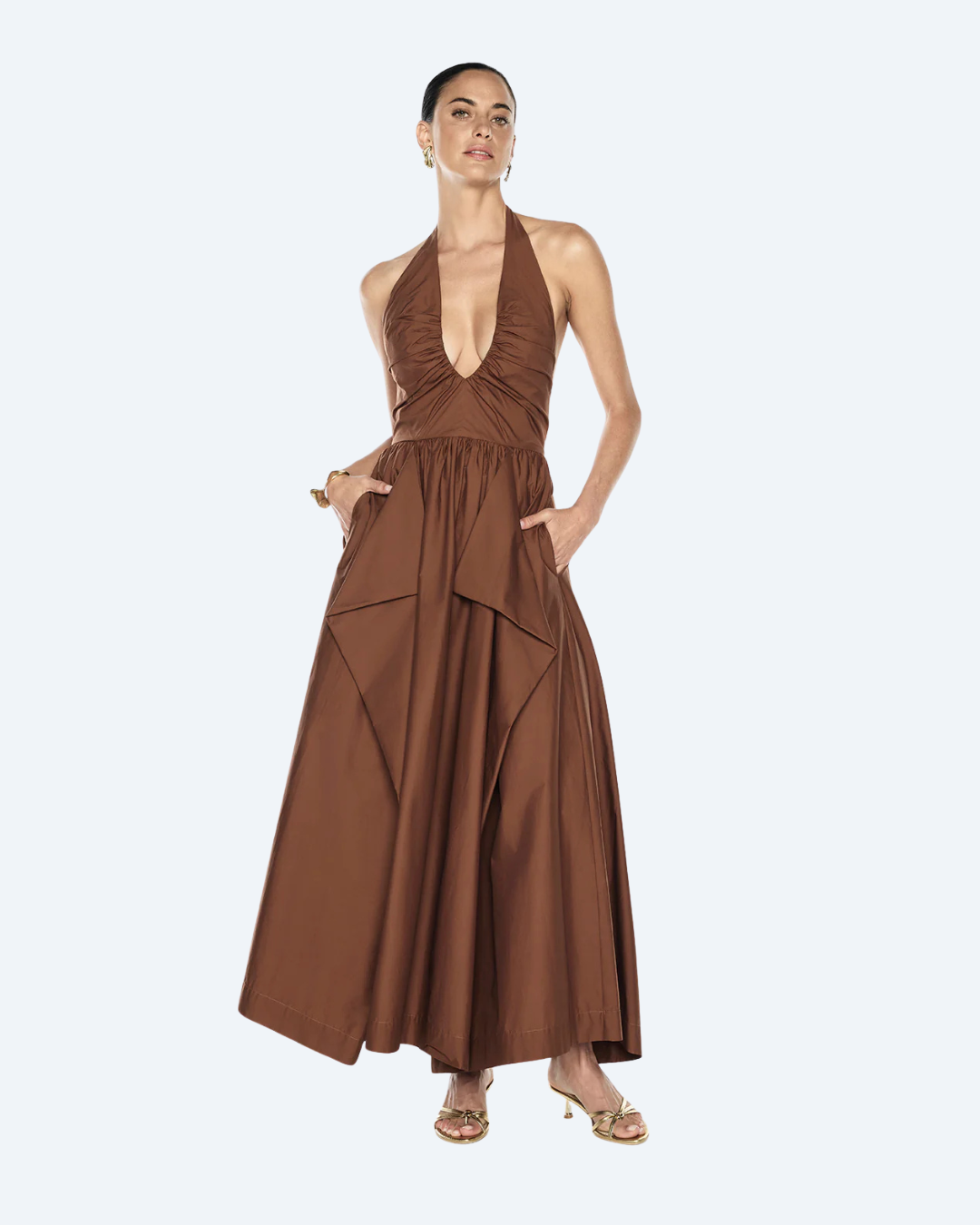Woman wearing a cognac manning martell provence halter dress on a white background