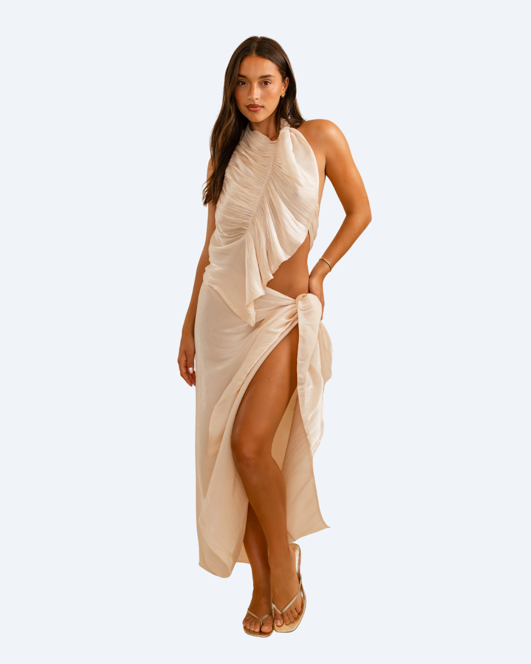 Woman wearing Koster Kulture champagne bobbie top and skirt set on light gray background, stylish two-piece outfit. front view 2.